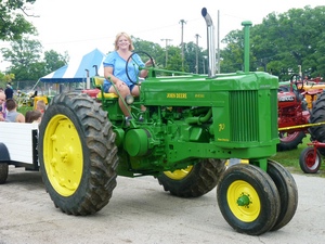 Vintage John Deere Tractor in parade at County Fair